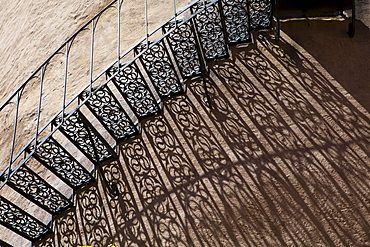 Shadow of an iron staircase at a tower