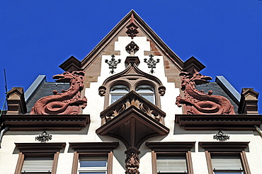 Gabled house with two dragon statues, 19th century, Hauptstrasse 93, Heidelberg, Baden-Wuerttemberg, Germany, Europe