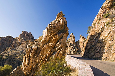 Road through red porphyry rocks, Calanche de Piana, Gulf of Porto, Corsica, France, Europe