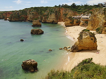 Typical steep coast, cliffs, at Praia da Dona Ana beach near Lagos, Algarve, Portugal, Europe