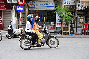 Women on motorcycle, Hanoi, Vietnam, Southeast Asia