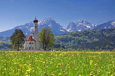 St. Coloman's Church near Tegelberg Mountain and Neuschwanstein Castle, Schwangau near Fuessen, Allgaeu region, Bavaria, Germany, Europe