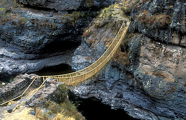 Queswachaka suspension bridge made from plant fibers, Ichu grass, over the Apurimac, Southern Peru, South America