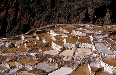 Salt production by evaporation on a mountain slope at Pichingote, the salt terraces were already in use during the time of the Incas, southern Peru, South America