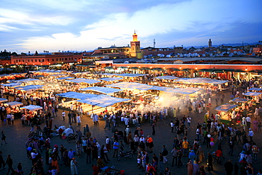 Djemaa el-Fna, "Square of the Hanged Man" in the medina quarter of Marrakech at dusk with its countless food stalls, Marrekech, Morocco, Africa