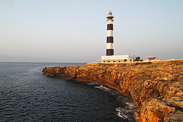 View of the lighthouse at Cap d'Artrutx in the morning light, Menorca, Spain, Europe