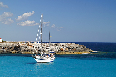 Bay with a boat near Son Xoriguer, Menorca, Spain, Europe