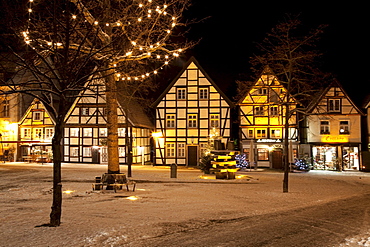 Half-timbered houses in the historic town centre with a Christmas tree and snow, Soest, Sauerland, North Rhine-Westphalia, Germany, Europe