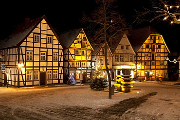 Half-timbered houses in the historic town centre with a Christmas tree and snow, Soest, Sauerland, North Rhine-Westphalia, Germany, Europe