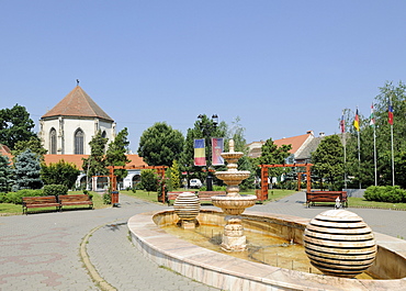 Fountain in the main square and church, Sebes, Muehlbach, Romania, Europe