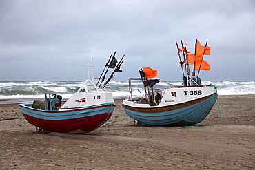 Fishing boats on the beach of Stenbjerg Landingsplads during a storm, North Sea, Thy district, northern Jutland, Jutland peninsula, Denmark, Europe