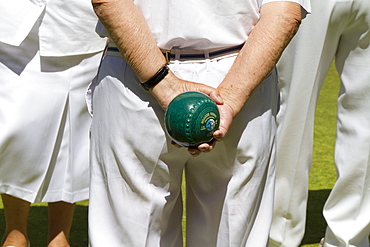 Man holding a bowling ball, Helston Bowling Club, Helston, Cornwall, England, United Kingdom, Europe