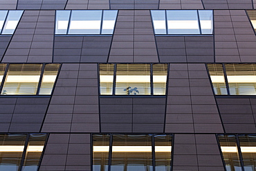 Modern facade with illuminated windows, office building in the Quartier Daimler, Potsdamer Platz, Berlin, Germany, Europe