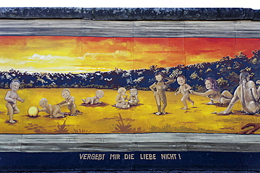 Many small naked children playing alongside their parents, painting by Henry Schmid on the remants of the Berlin Wall, East Side Gallery, Friedrichshain district, Berlin, Germany, Europe