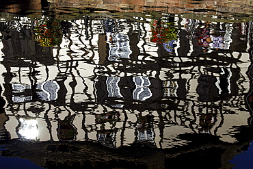 Half-timbered buildings reflected in canal, Strasbourg, Alsace, France, Europe