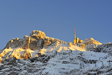 The roughly 2500m high summit of Saentis mountain in the last sunlight as seen from the north, Appenzell Alps, canton of Appenzell Innerrhoden, Switzerland, Europe