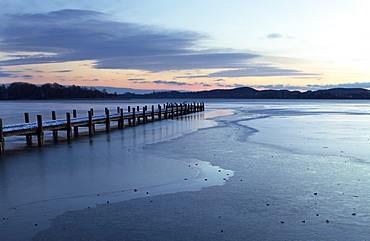 Jetty at sunrise on Lake Woerth in winter, Upper Bavaria, Bavaria, Germany, Europe