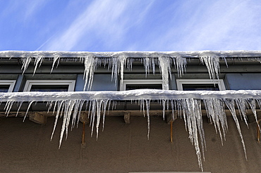 Icicles on the eaves of a hotel, Schlossberg Osternohe, Middle Franconia, Bavaria, Germany, Europe