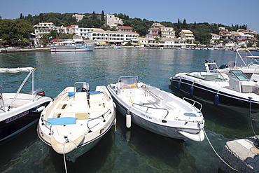 Boats moored in the harbour of Kassiopi, Corfu, Greece, Europe