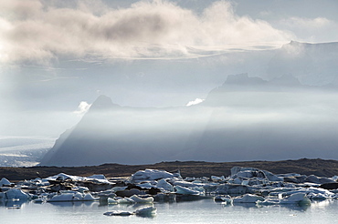 Icebergs floating in the Joekulsarlon glacier lagoon, South Iceland, Europe