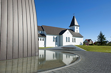 Church and reflection in water, Keflavik, Iceland, Scandinavia, Northern Europe, Europe