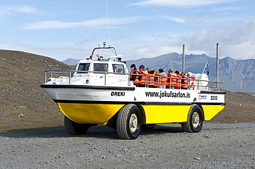 Amphibious vehicle driving on land, converted American LARC-5, tourists on board, Joekulsarlon glacial lake, Joekulsarlon, Iceland, Scandinavia, Northern Europe, Europe