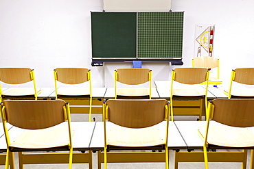 Chairs on desks in a classroom in a school in Straubing, Bavaria, Germany, Europe