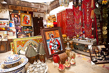 A merchant and his goods in the souk, bazaar, Medina, Fes, Morocco, Africa