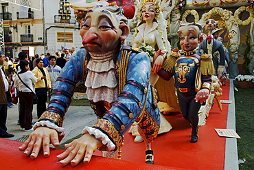 Woman dominating a man, footmen rolling out the red carpet, crude carnival characters and satirical sculptures at a parade, Fallas festival, Falles festival in Valencia in early spring, Spain, Europe