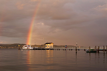 Pier on Lake Constance in Dingelsdorf with a rainbow on the horizon, Baden-Wuerttemberg, Germany, Europe