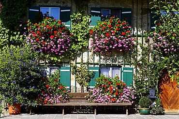 Old farmhouse decorated with flowers, Seeleiten near Teisendorf, Rupertiwinkel region, Upper Bavaria, Bavaria, Germany, Europe