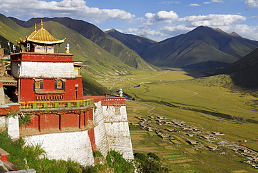 View of the valley and the golden roofs of Drigung Til Monastery, Tibet, China, Asia