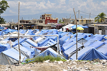 Temporary camp set up on a former football field, for refugees of the earthquake in January 2010, Port au Prince, Haiti, Central America