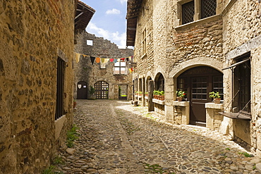 Cobblestone street, medieval walled town of Perouges, France, Europe