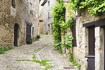 Cobblestone street, medieval walled town of Perouges, France, Europe