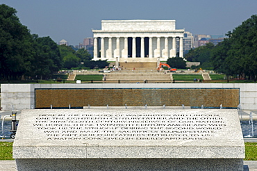 Inscription on the World War II Memorial, the Lincoln Memorial behind, Washington DC, USA, America