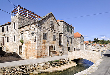 Bridge over the river in the historic town centre, Vrboska, Hvar Island, Croatia, Europe