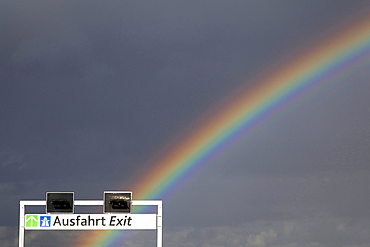 Rainbow above the sign of a garage exit, Cologne, North Rhine-Westphalia, Germany, Europe