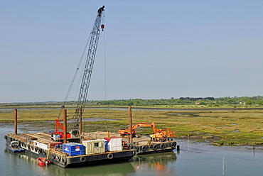 Harbour construction site with cranes and excavators on pontoons, Lymington, southern England, England, United Kingdom, Europe