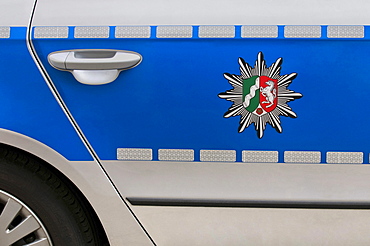 Coat of arms of North Rhine-Westphalia on a blue police car