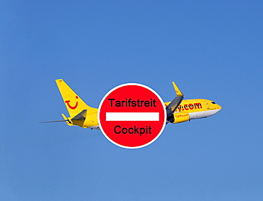 Sign for rate dispute of the Cockpit Union with TUI airline plane at back