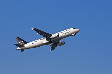 Star Alliance aircraft of Aegean Airlines shortly after take-off with landing gear closing, Airbus A32