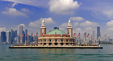 Navy Pier amusement park seen from Lake Michigan in front of the skyline with the John Hancock Center and the Aon Building, Chicago, Illinois, United States of America, USA