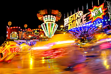 Breakdance ride at night, motion blur, Cannstatter Wasen or Volksfest, Stuttgart Beer Festival, Wasen, Bad Cannstatt, Stuttgart, Baden-Wuerttemberg, Germany, Europe