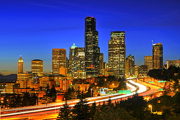 Night shot, Interstate 5 motorway in front of the skyline of the Financial District in Seattle, Columbia Center, formerly known as Bank of America Tower, Washington Mutual Tower, Two Union Square Tower, Municipal Tower, formerly Key Tower, U.S. Bank Cente