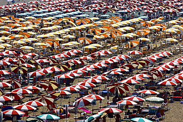 Parasols and sun loungers, mass tourism on the beach of Caorle, Adriatic Sea, Italy, Europe