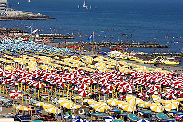 Parasols and sun loungers, mass tourism on the beach of Caorle, Adriatic Sea, Italy, Europe