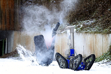 Radio control robot from the Telerob company to defuse explosives, bombs and other dangerous devices by remote control, the water gun uses extreme high pressure to render the explosive device unusable