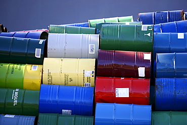 Empty metal drums used for chemicals stockpiled in a recycling company