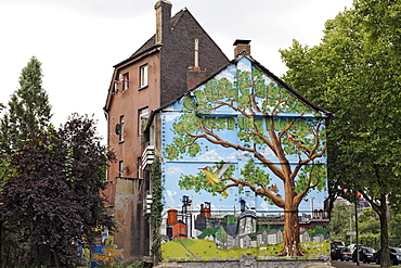 Old house about to be demolished, wall painted with a tree in an industrial landscape, Bruckhausen district, Duisburg, North Rhine-Westphalia, Germany, Europe